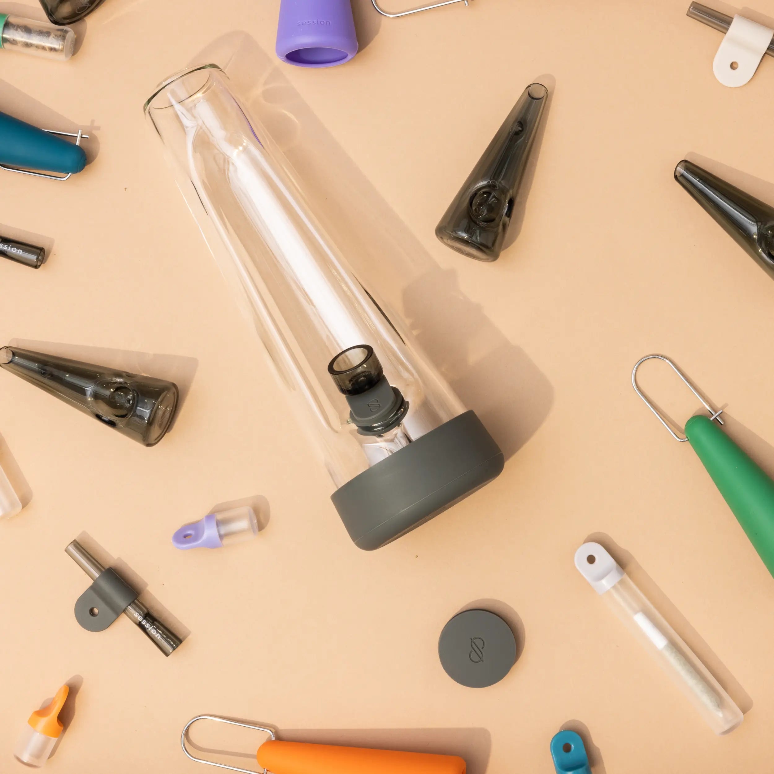 Bundle & Save up to 30% off. Charcoal Bong flatlaid on a peach back drop with other award winning session goods products