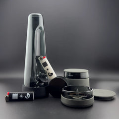 Session Goods Ultimate Bong Bundle in Ash, featuring the designer black glass bong, matching debowler ashtray, stash jar, and black and white designer lighters.