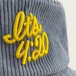 Close-up of “It’s 4:20” embroidery on a light blue Session Goods corduroy bucket hat