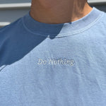 Session Goods relaxed fit tee in washed blue with minimalist ‘do nothing’ embroidery – perfect for slowing down.