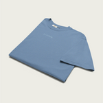 Comfortable faded blue t-shirt featuring subtle ‘do nothing’ stitching – a chill essential by Session Goods.