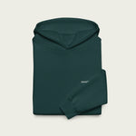 Close-up of the Session logo printed on the soft pine green fabric.