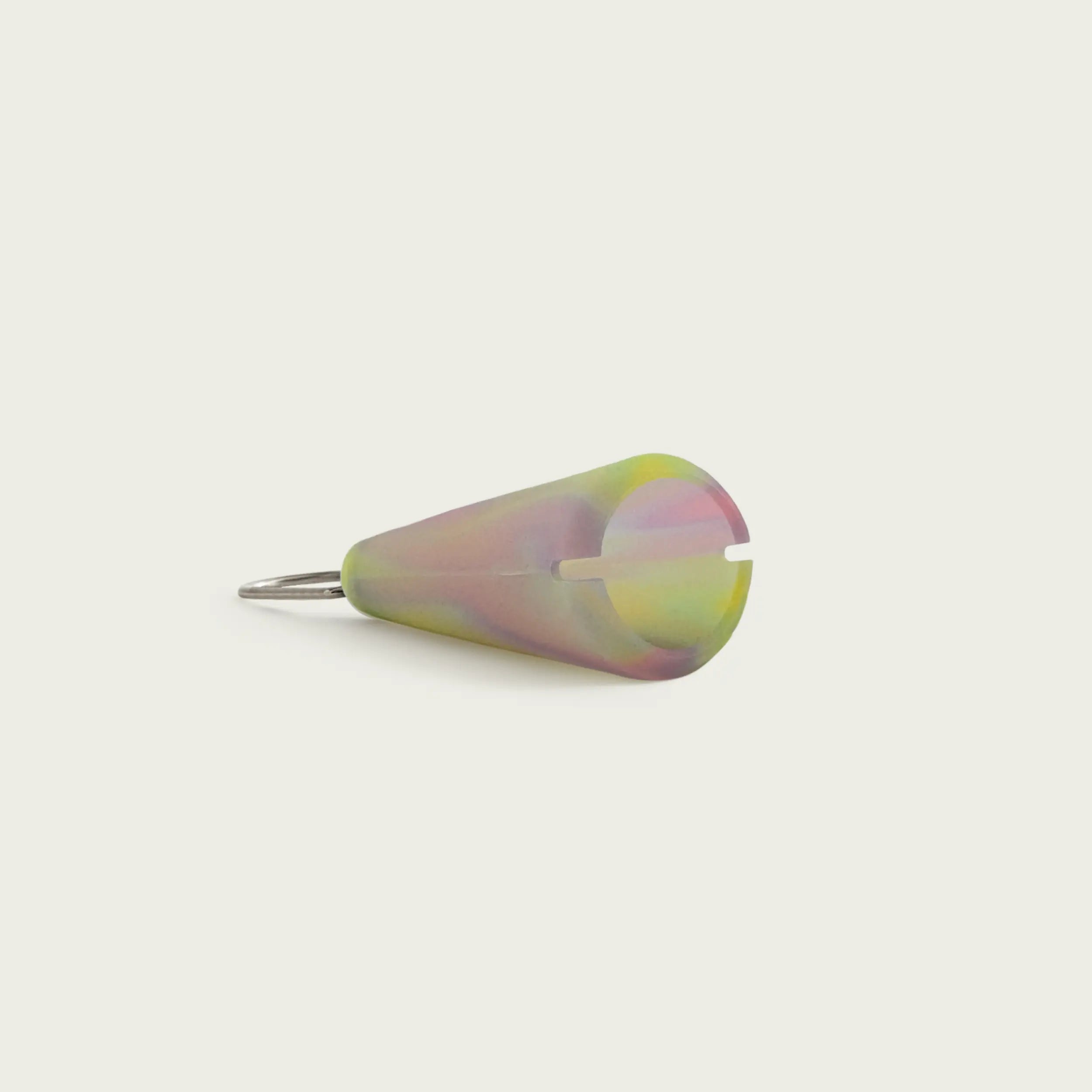 Session Goods Aura Green Pipe Sleeve laid flat – swirled silicone in soft green, pink, and yellow tones with slot for easy attachment.