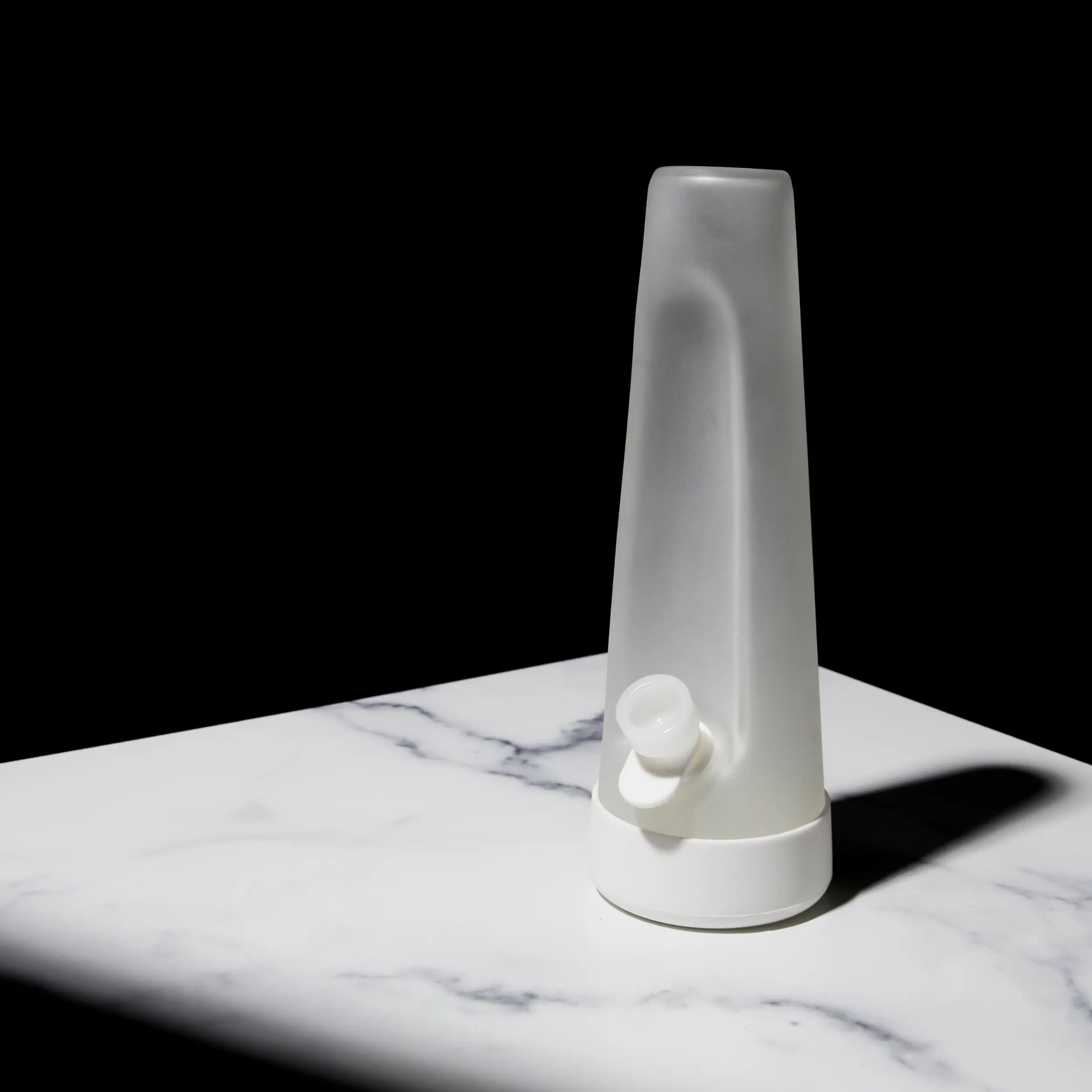 Designer Edition Cloud white Bong on a Carrara marble table.