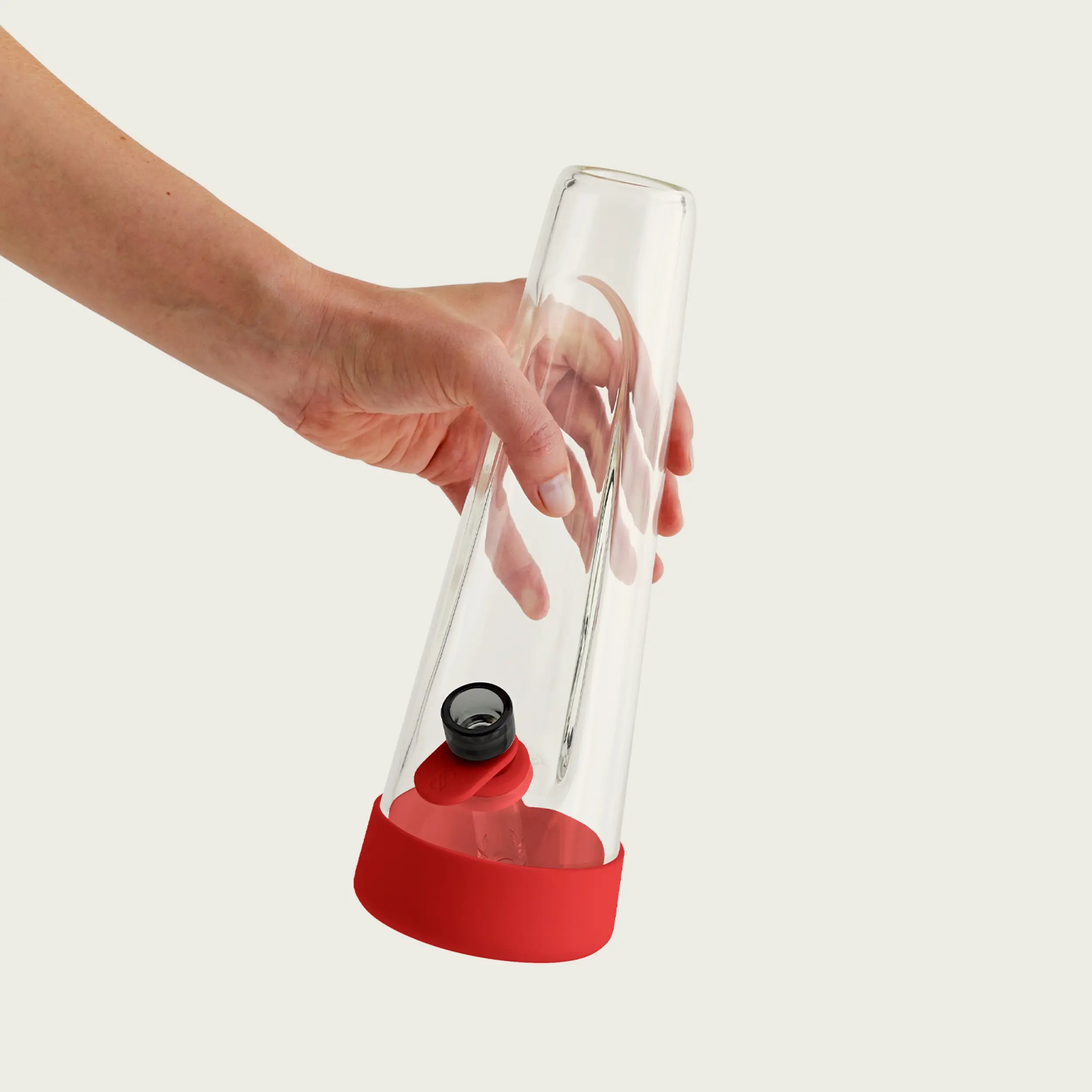 Session Goods crimson red designer bong with a minimalist glass body and a bold silicone sleeve and base, combining elegance and functionality for the perfect smoking experience.