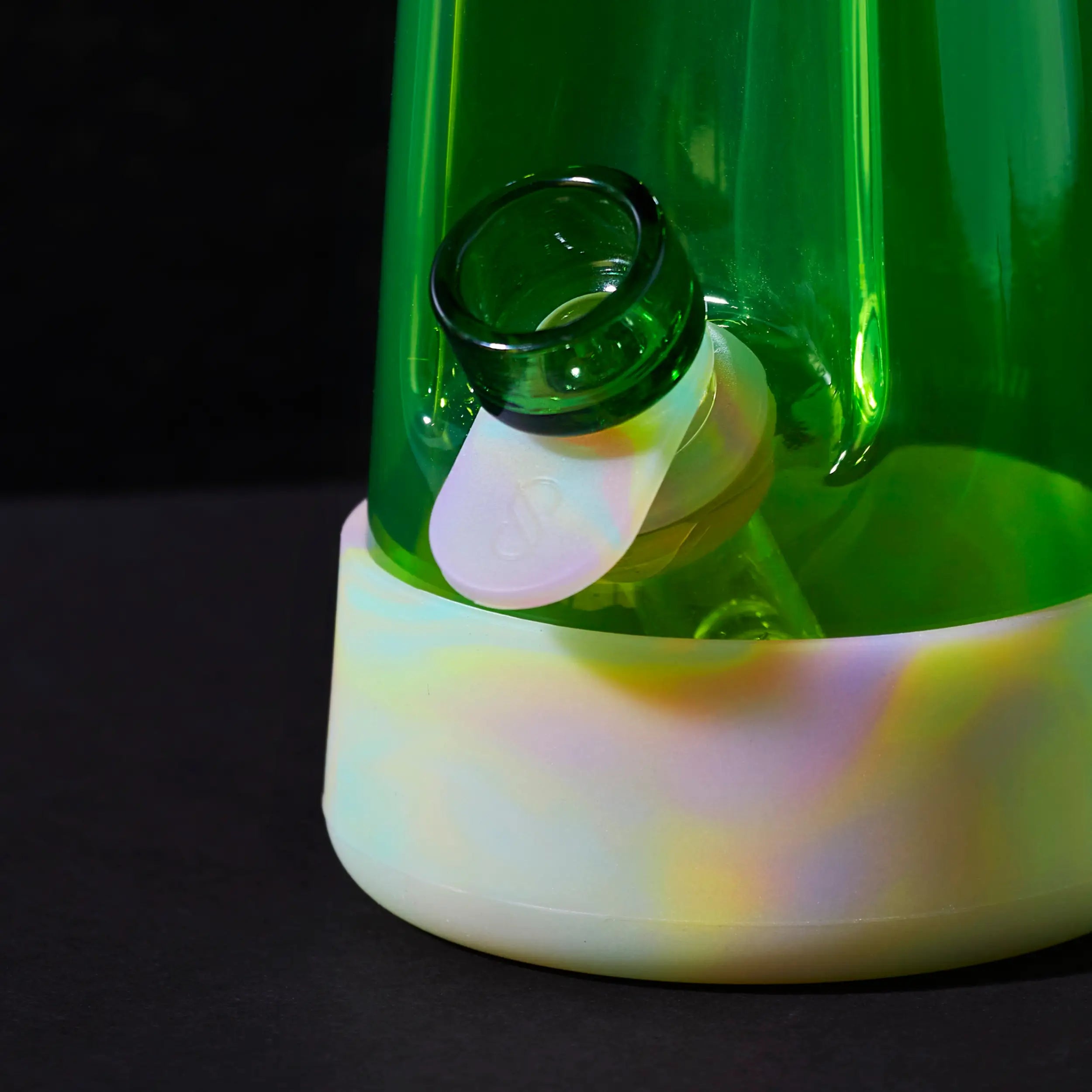 a glow-in-the-dark glass bong and pipe with silicone sleeve in collaboration with session goods x weedfeed with customer designed packaging