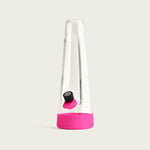 architectural studio shot of the Session Bong at a slight angle, showcasing the seamless integration of the Magenta Pink silicone accessories against the minimalist glass silhouette.
