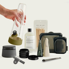 Session Goods Ultimate Bundle featuring a 10-inch Olive green glass bong, Memory off-white handheld pipe, Charcoal one-hitter, Stash Jar, and complete Cleaning Kit with 16oz solution and pouches.
