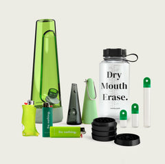 glow-in-the-dark green glass designer bong. the ultimate bundle also includes bong, pipe, water bottle, stash kit, grinder and lighters
