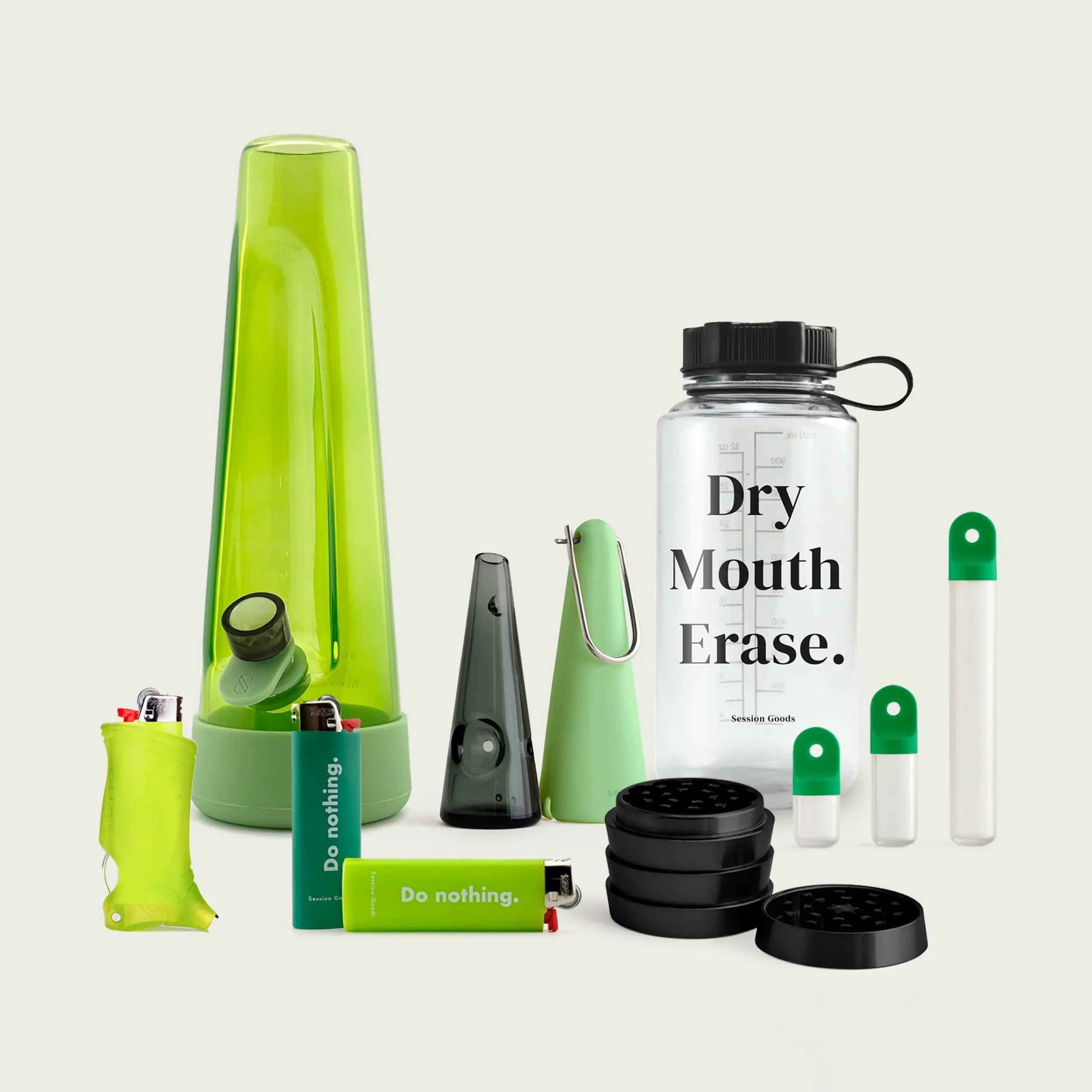 Session Goods Designer Series Ultimate Bundle in green tones, featuring a translucent green bong, matching silicone accessories, two ‘Do nothing.’ branded lighters, a clear water bottle labeled ‘Dry Mouth Erase.’, a sleek one-hitter pipe with cone sleeve, a black four-piece grinder, and two stash pods with green caps—all arranged on a neutral background.