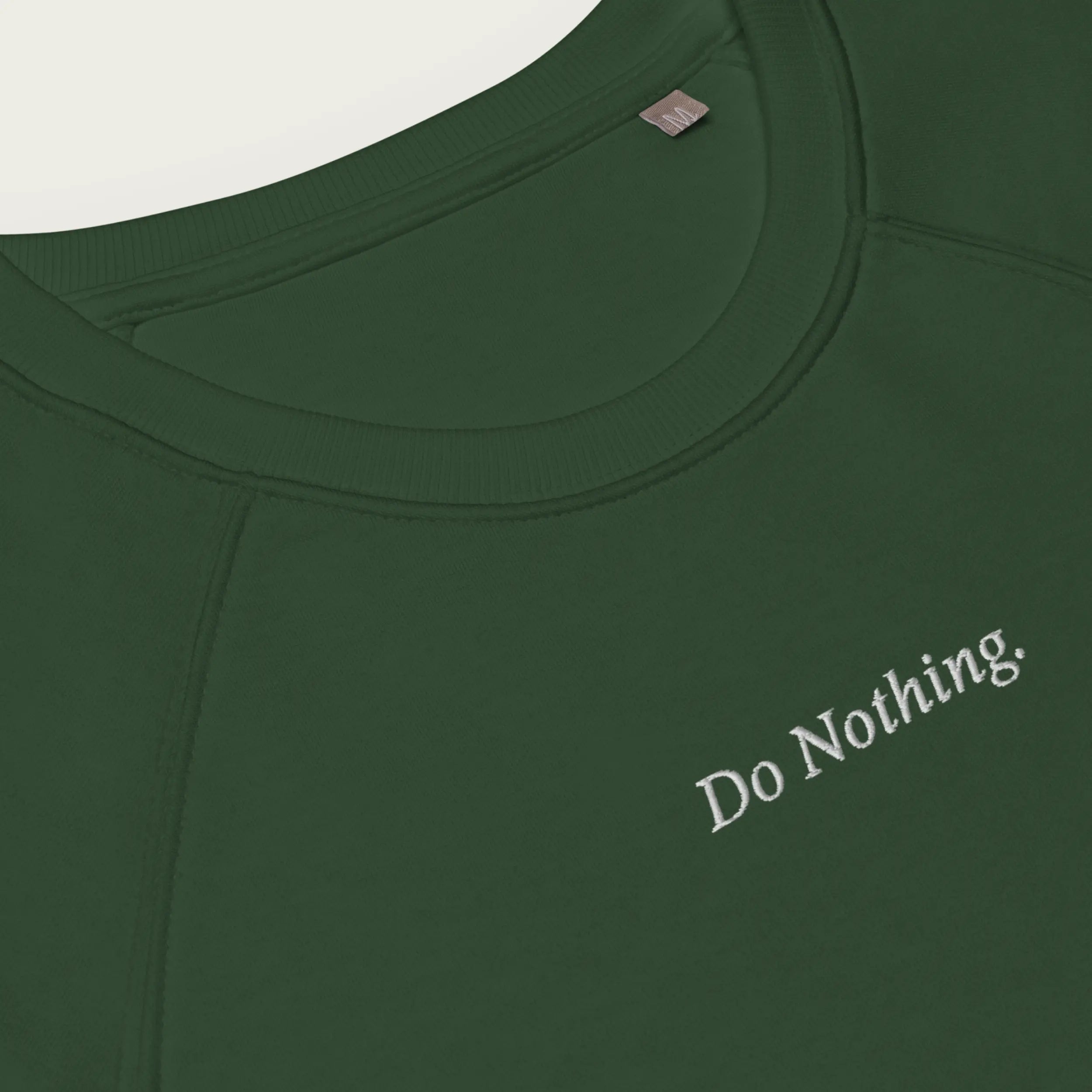 Comfortable green sweatshirt with subtle ‘Do Nothing’ embroidery for a laid-back look.