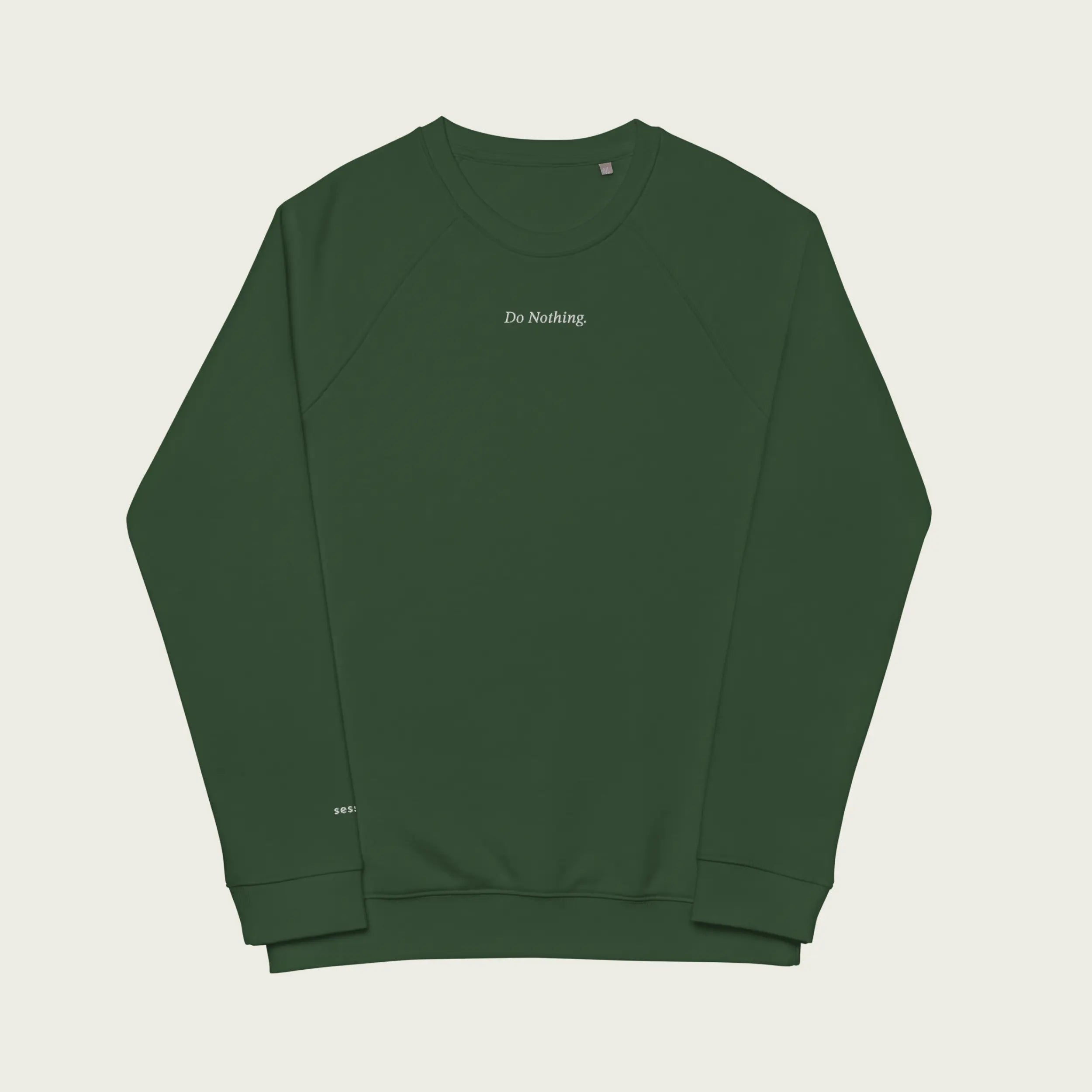 Minimalist green sweatshirt with ‘Do Nothing’ embroidered in simple, understated text.