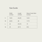 A clean-lined, tan and cream table titled 'Size Guide' presents measurements in inches for t-shirt sizes Small, Medium, Large, and Extra-Large. The table details 'Width', 'Length', and 'Sleeve Center Back' dimensions for each size in a simple, minimalist style.