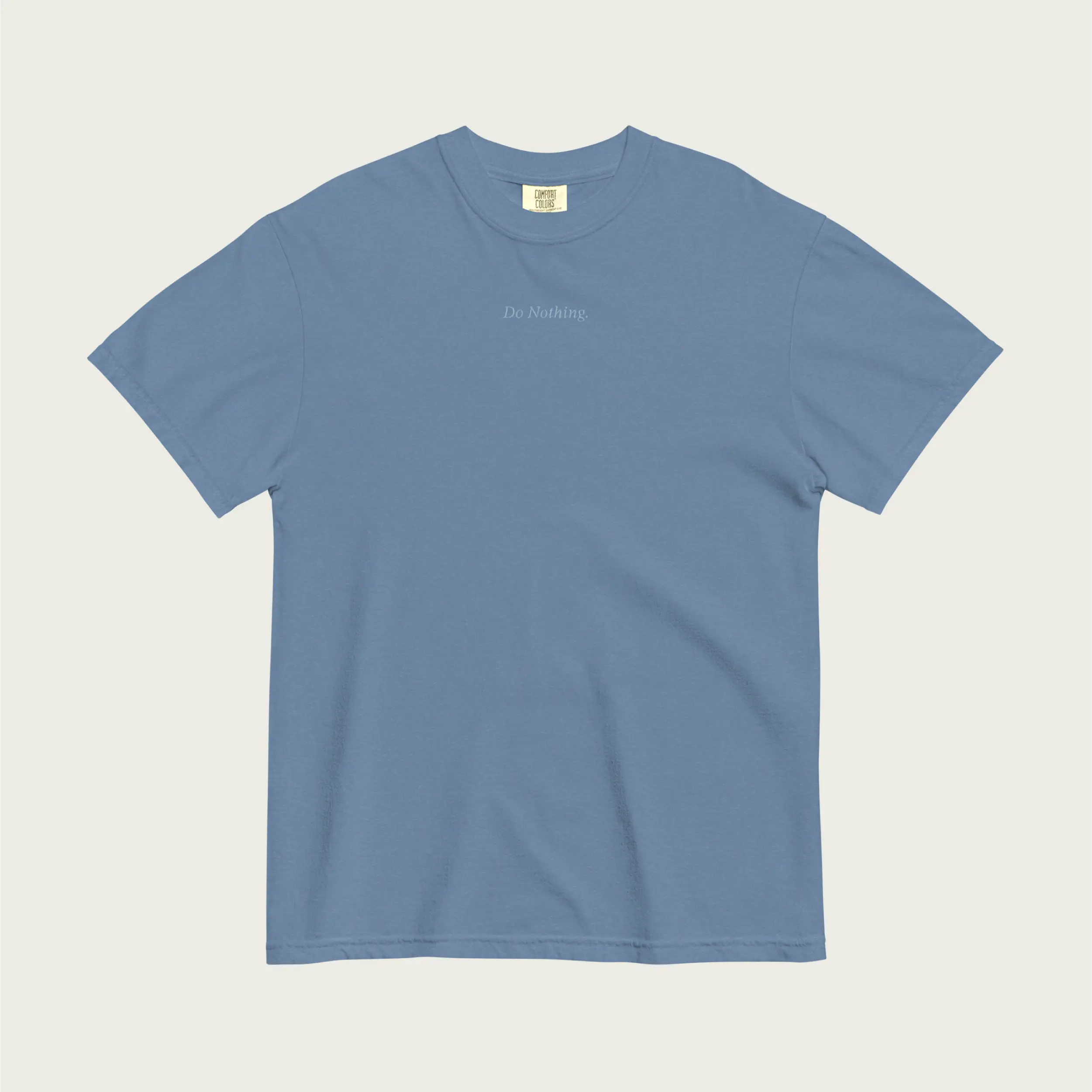 Faded blue comfort t-shirt by Session Goods with ‘do nothing’ embroidered on the chest – soft, laid-back everyday wear.