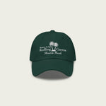 Front view of green Session Goods Rolling Garros dad hat with white embroidered palm tree and resort-style logo.