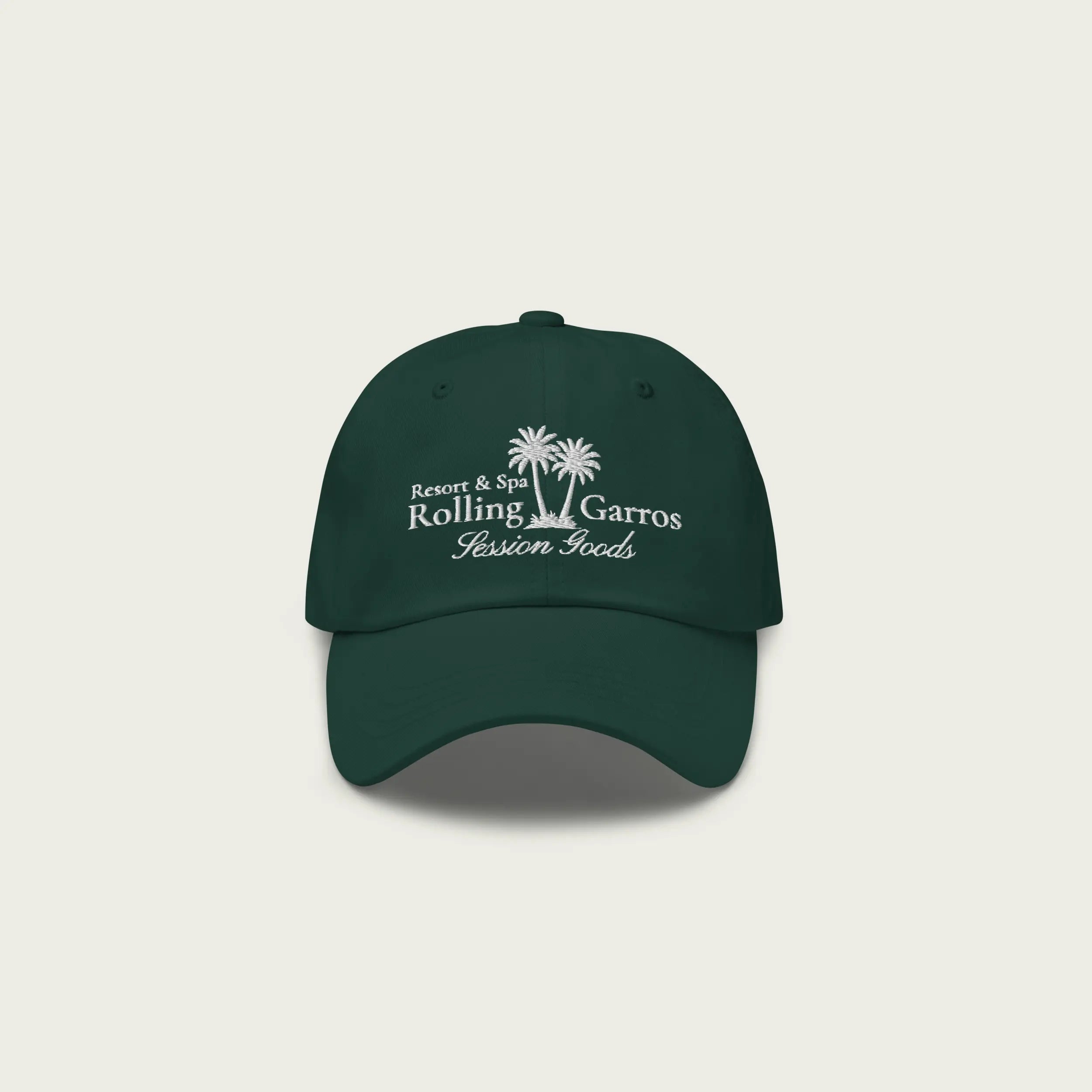 Front view of green Session Goods Rolling Garros dad hat with white embroidered palm tree and resort-style logo.