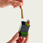A demonstration of the OG Hautebox in Black Pearl being used as a smell-proof and waterproof travel case for a lighter and pre-roll.