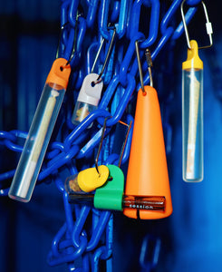 Featured 2 image has multi-color stash tubes and pods clipped to a blue plastic chain storing flower, next to a session goods one-hitter and elegant glass pipe